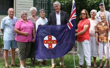 New flag: Geoff Provest and members of the Tweed Heads Historical Society raise the New South Wales flag. New flag: Geoff Provest and members of the Tweed Heads Historical Society raise the New South Wales flag.